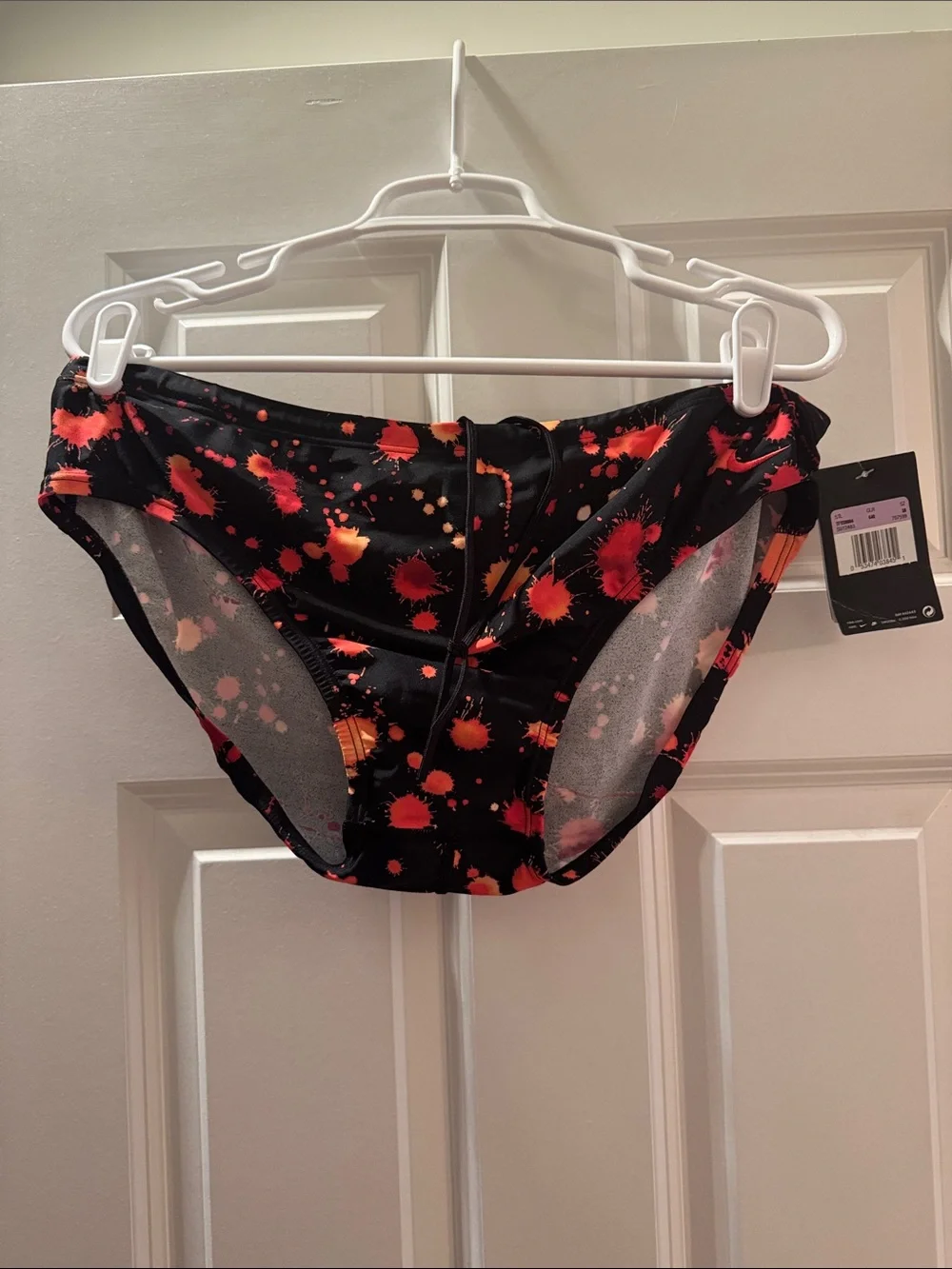 Nike Men’s Black Swim Briefs with Red and Orange Splatter Size 38.